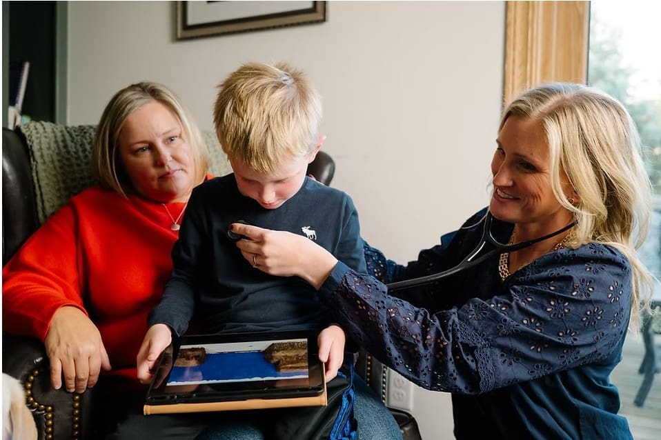 dr sarah visiting a child at home as a direct primary care provider