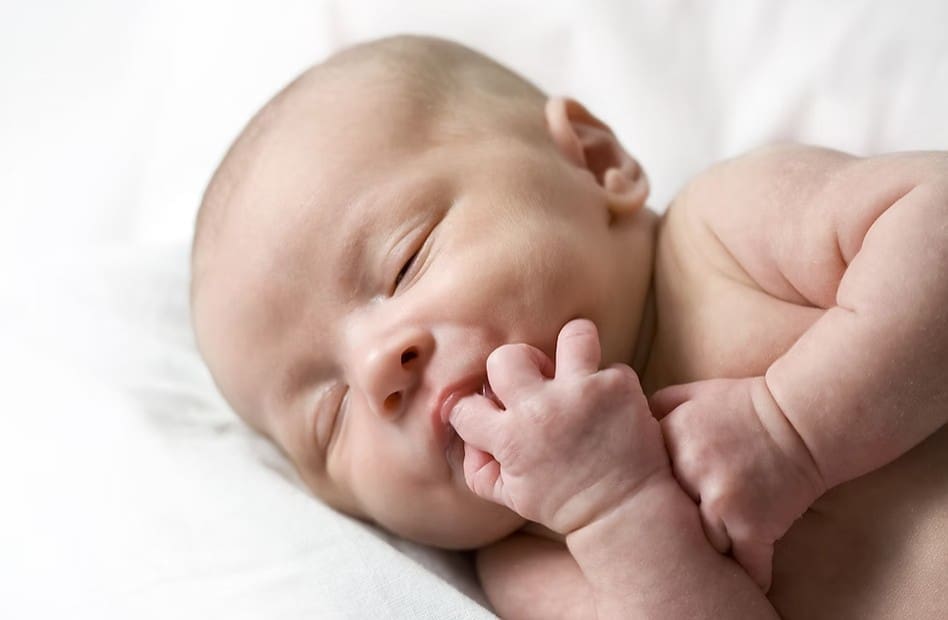 Part 1 Vitamin K For Newborns baby sleeping laying sucking on finger