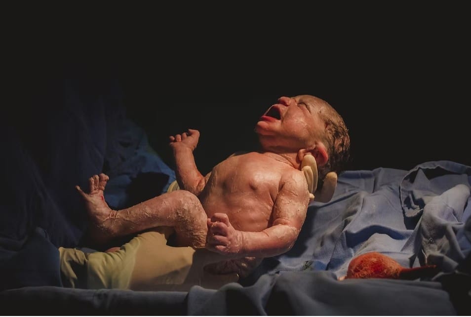 crying newborn baby during c section
